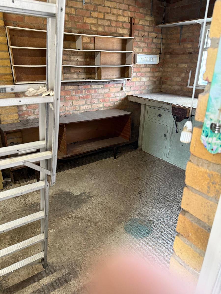 Cleared garage workshop after clearance
