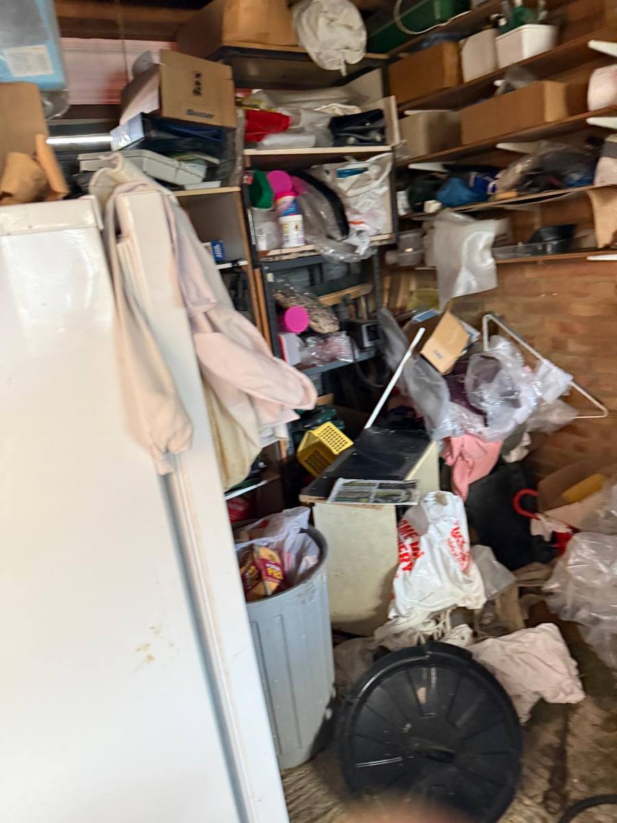 Cluttered store room before clearance